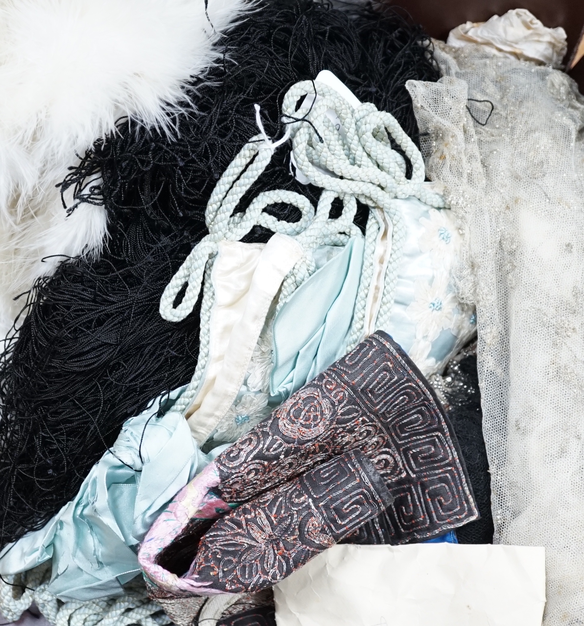 A linen sheet with embroidered turn back Chinese embroidered rank badge, a cream beaded panel, two hankie sachets, a swan's down cape, black fringing etc